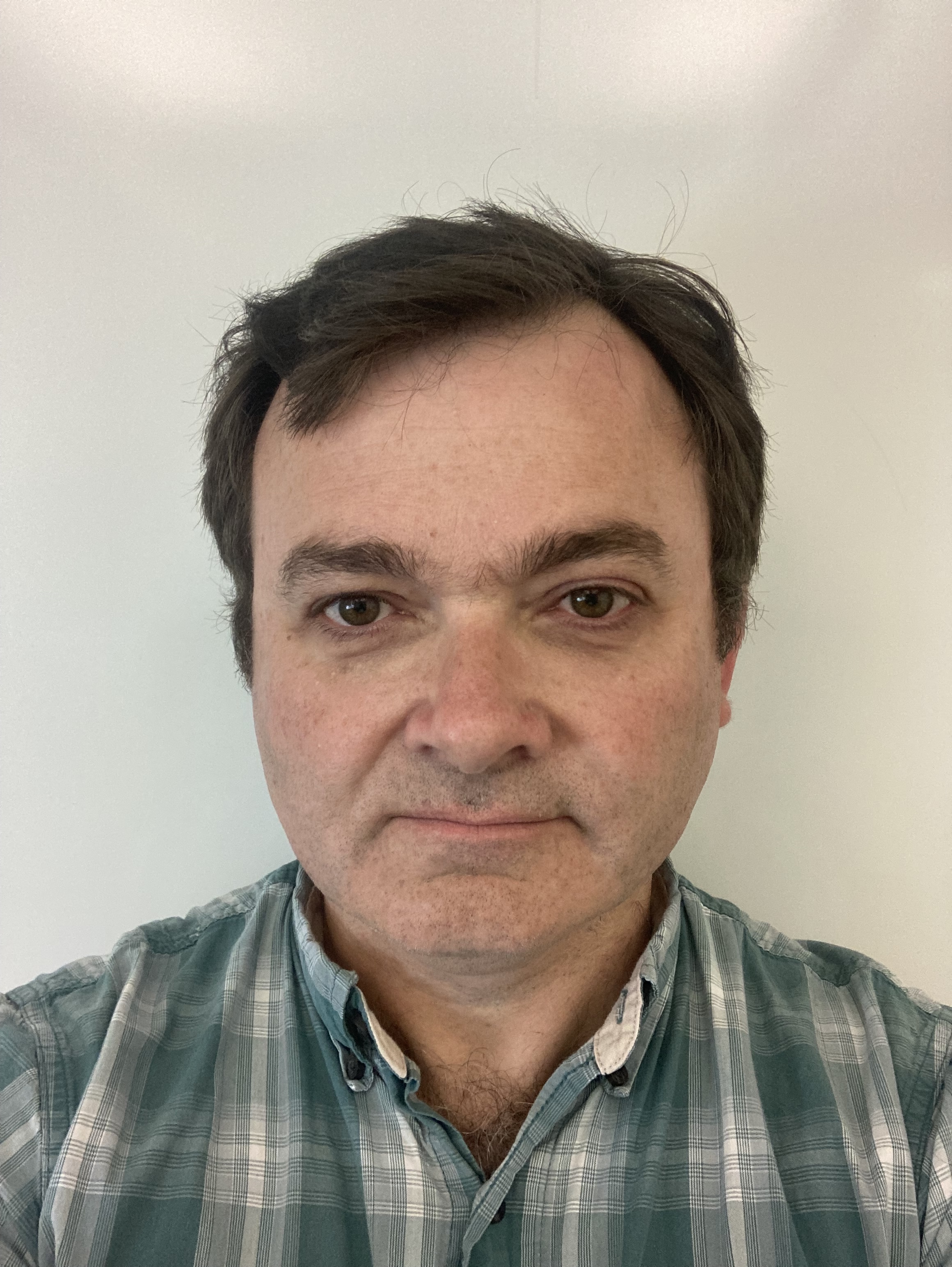 A selfie headshot of Paul Blakemore, a middle aged white person with short dark hair.